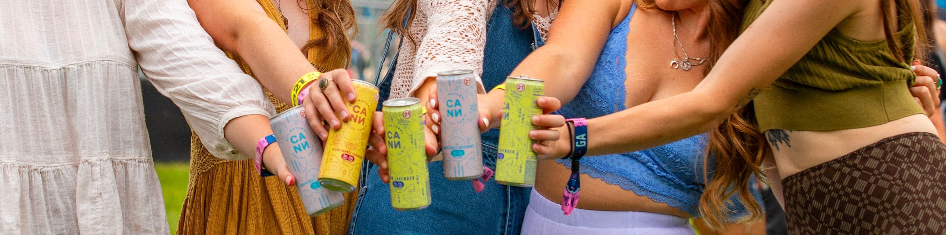 Group of friends holding Cann Hi Boy products